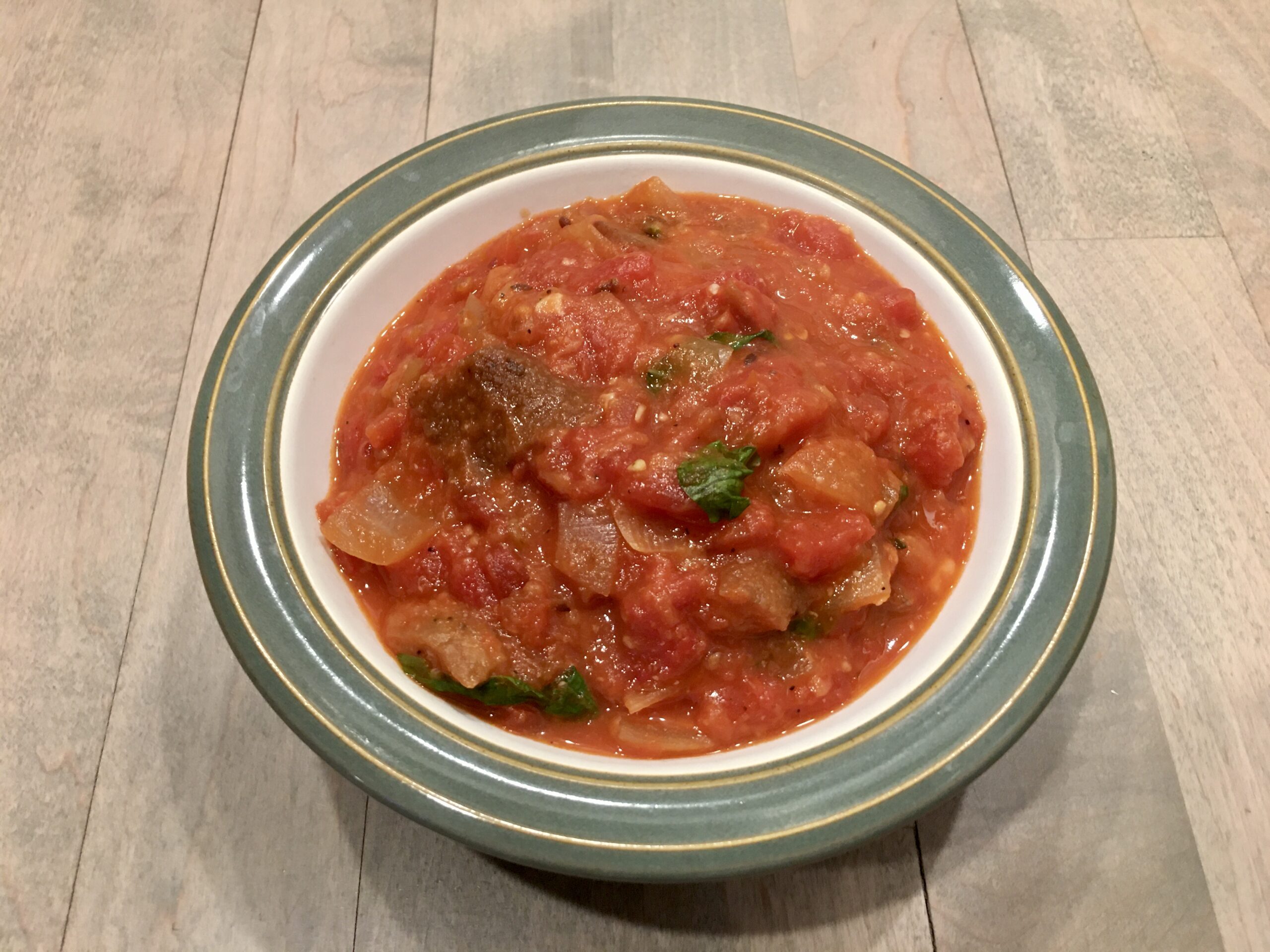 Tomato and Bread Soup served in green bowl