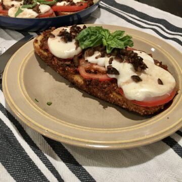 Single piece of sourdough pizza on a tan plate